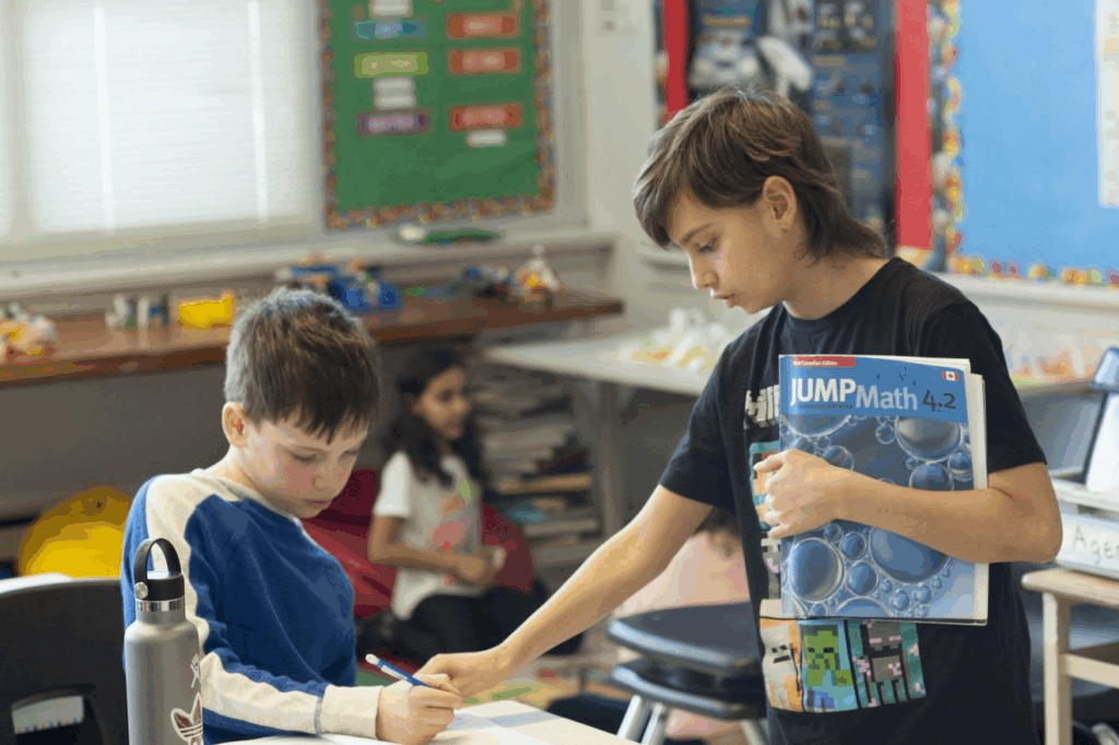 student assisting another student with math