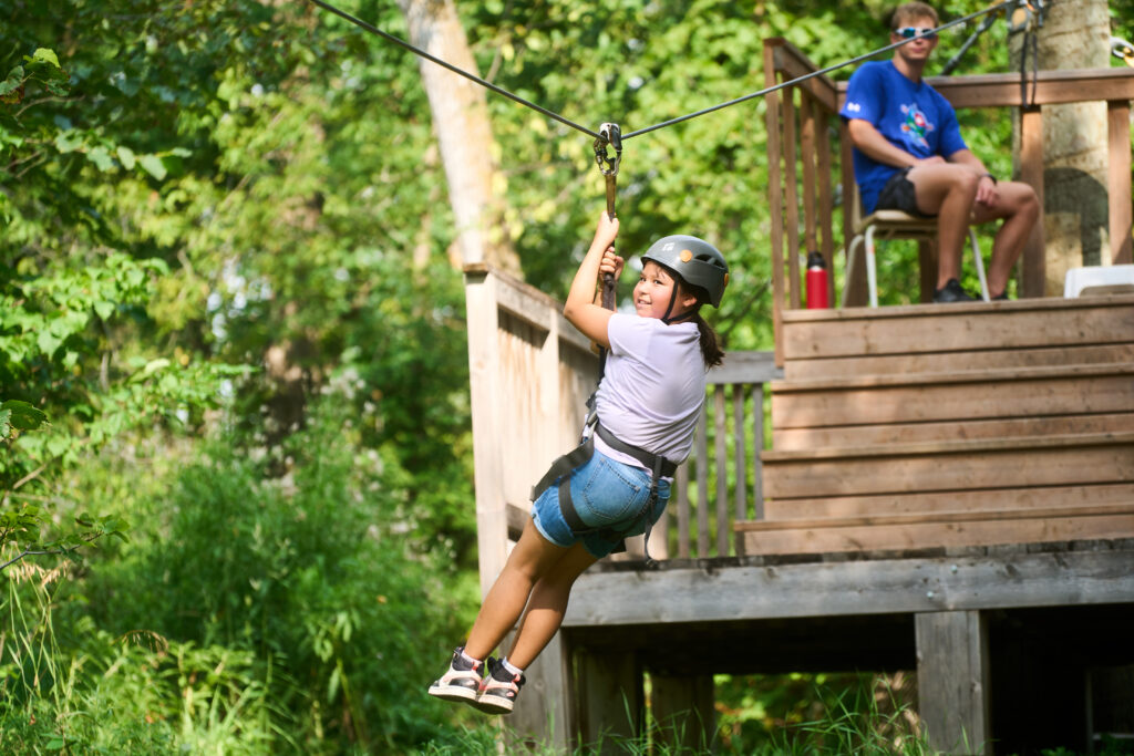 Ziplining at Camp Firefly, a grief camp to help children and youth process losing a loved one while getting out into nature and having some fun.