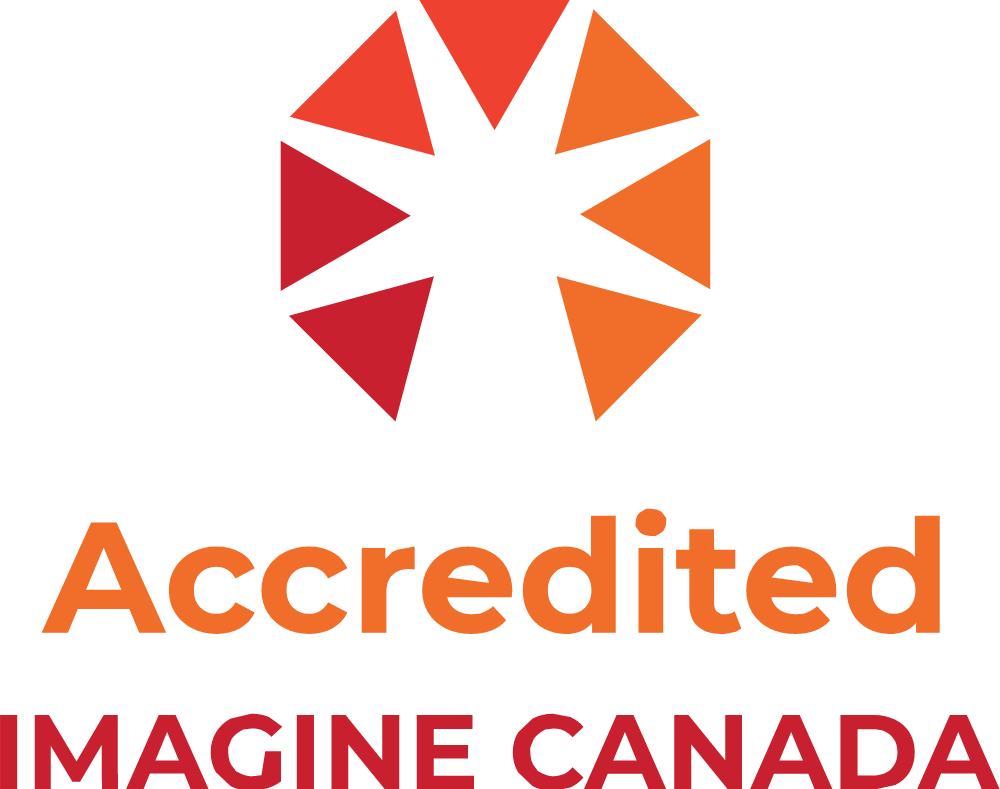 Logo: Accredited Imagine Canada. Illustration of a partial circle composed of small triangles in shades of red and orange pointing inward.