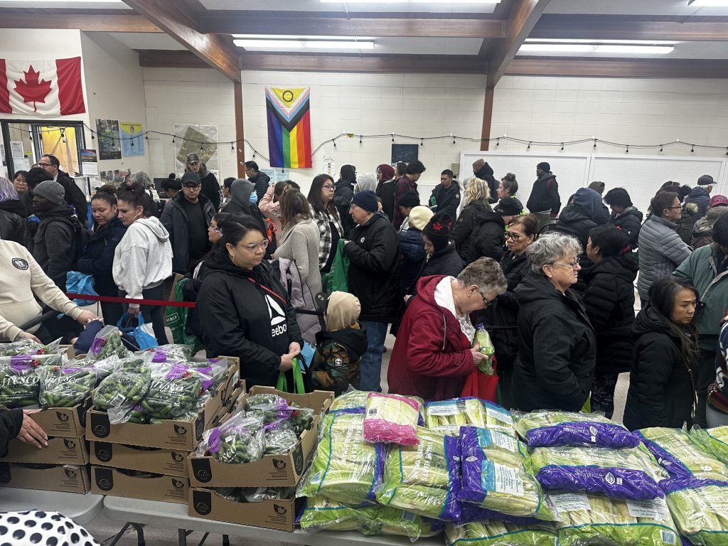 Participants are lined up in rows for Chalmers Neighbourhood Renewal Better Access to Groceries program.