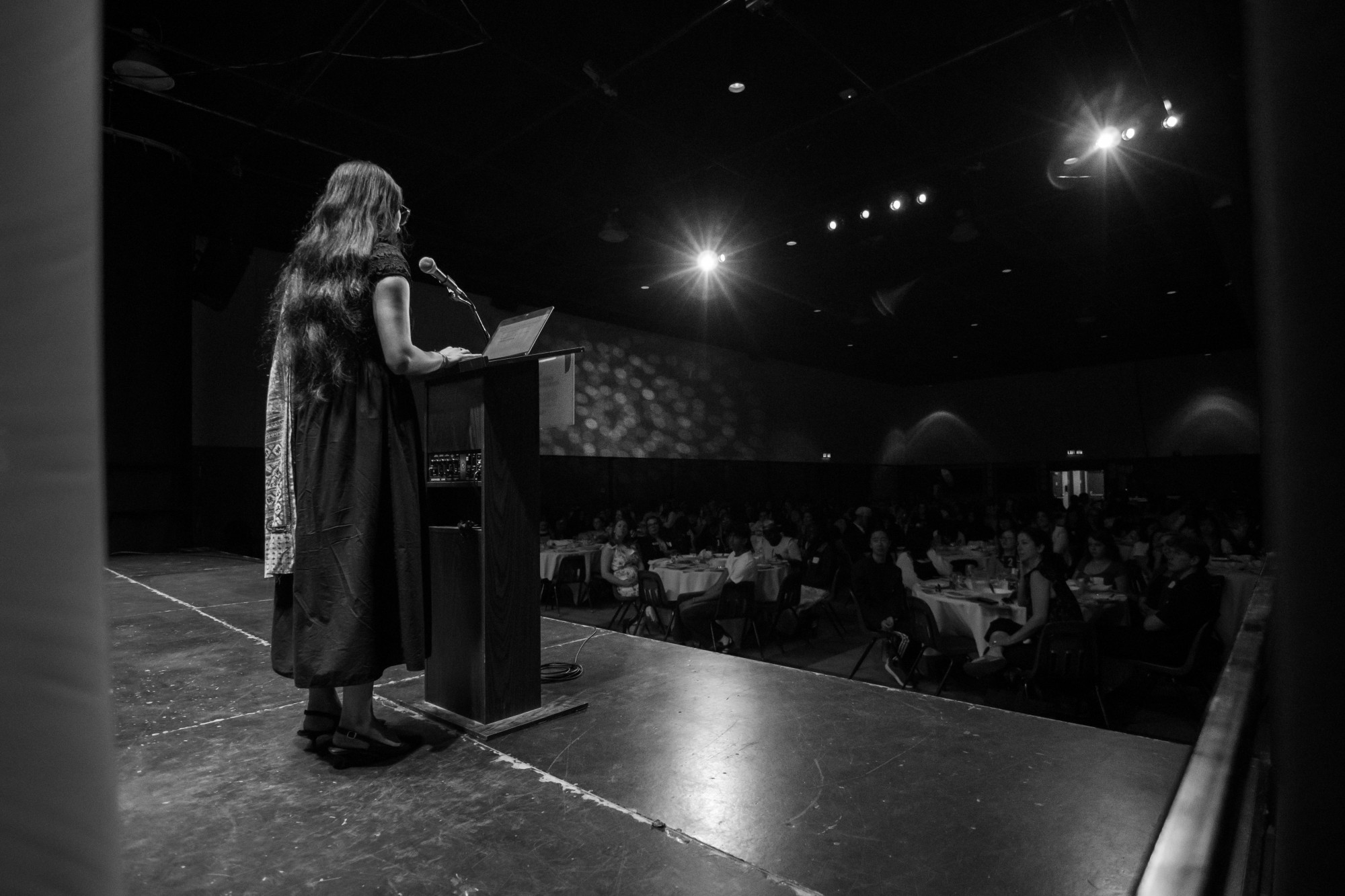 Divya Sharma, Youth in Philanthropy Alumna speaking to a crowd of students.